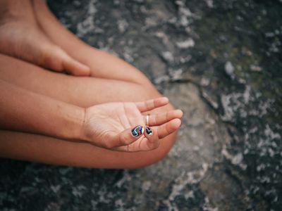 Close up of hands in a mudra position during meditation.